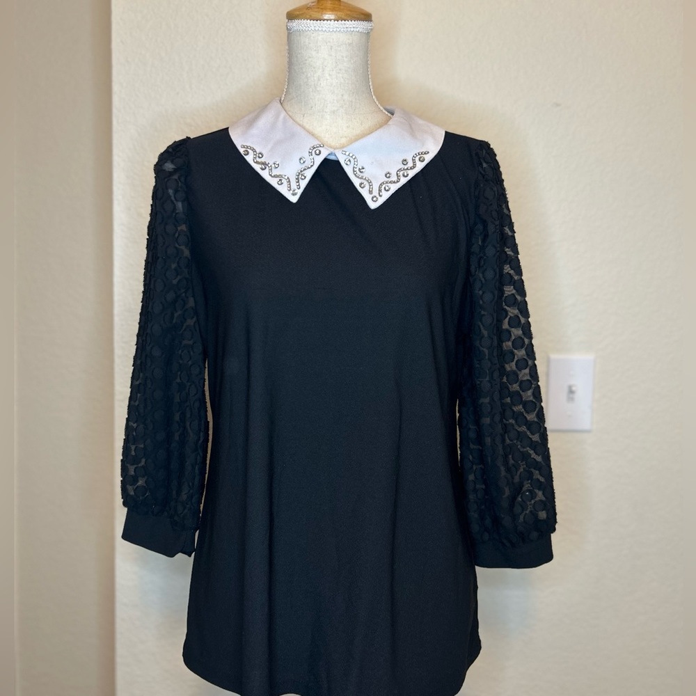 Black with a white color blouse size large